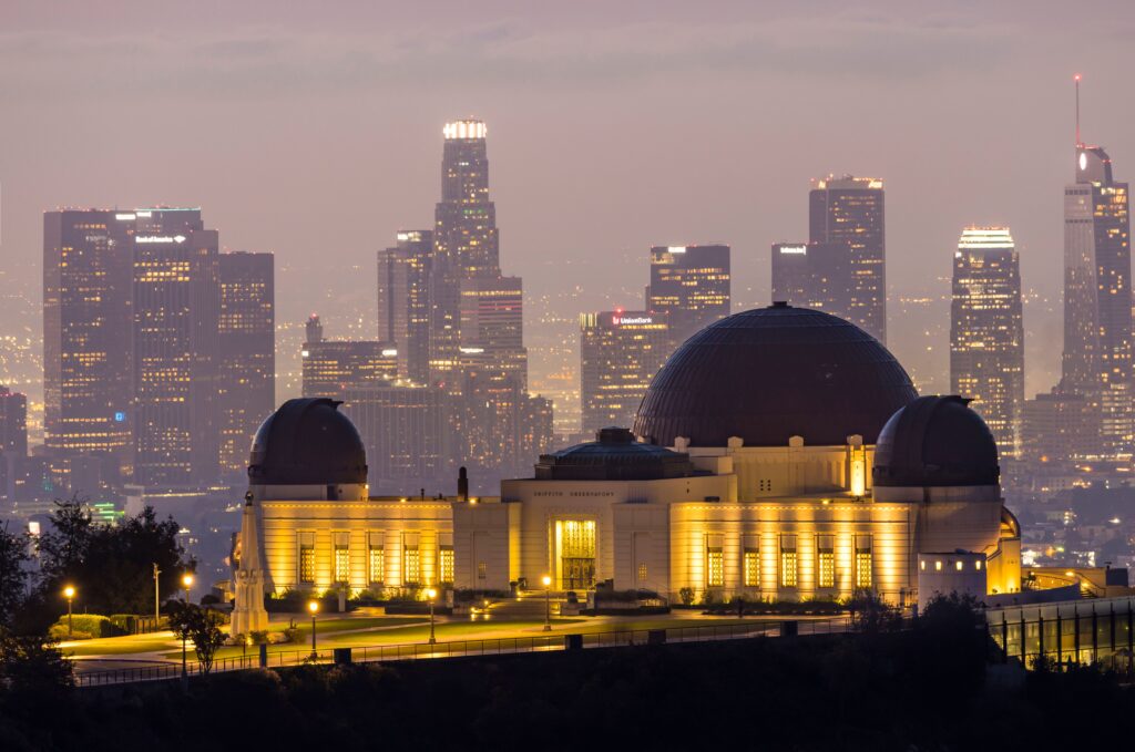 La La Land Los Angeles Griffith Observatory against the Los Angeles skyline during twilight, showcasing city lights and architectural beauty.